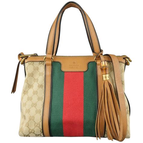 gucci signature gucci's green and red stripe one handle handbag|Gucci signature large hobo bag.